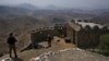 FILE - Pakistan Army troops observe the area from hilltop post on the Pakistan-Afghanistan border, Aug. 3, 2021. Local security officials in Khyber said a gunfight between TTP assailants and security forces erupted Friday, resulting in the deaths of at least two personnel. 