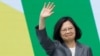 FILE - Taiwan's former President Tsai Ing-wen waves during the inauguration of new President Lai Ching-te and new Vice President Hsiao Bi-khim, outside the Presidential office building in Taipei, May 20, 2024.